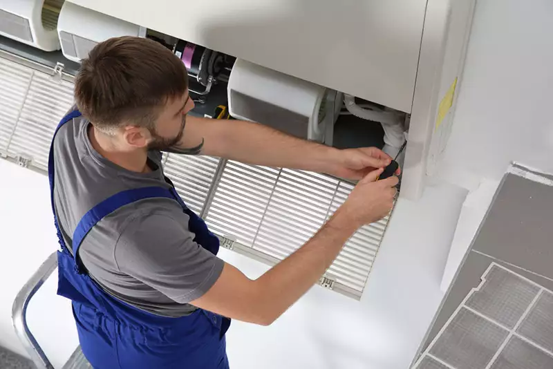 Corner Gas HVAC technician installing HRV air quality equipment in London Ontario
